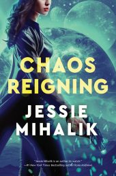 CHAOS REIGNING cover. A woman with dark, curly hair, in a long leather coat, facing left and holding a blaster. The background is an alien landscape with a planet and two moons in the sky and everything is shaded green-blue.
